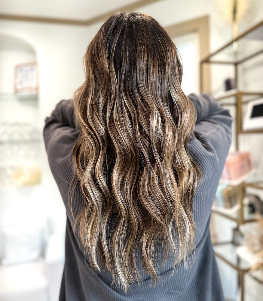 Guest with long wavy highlighted hair